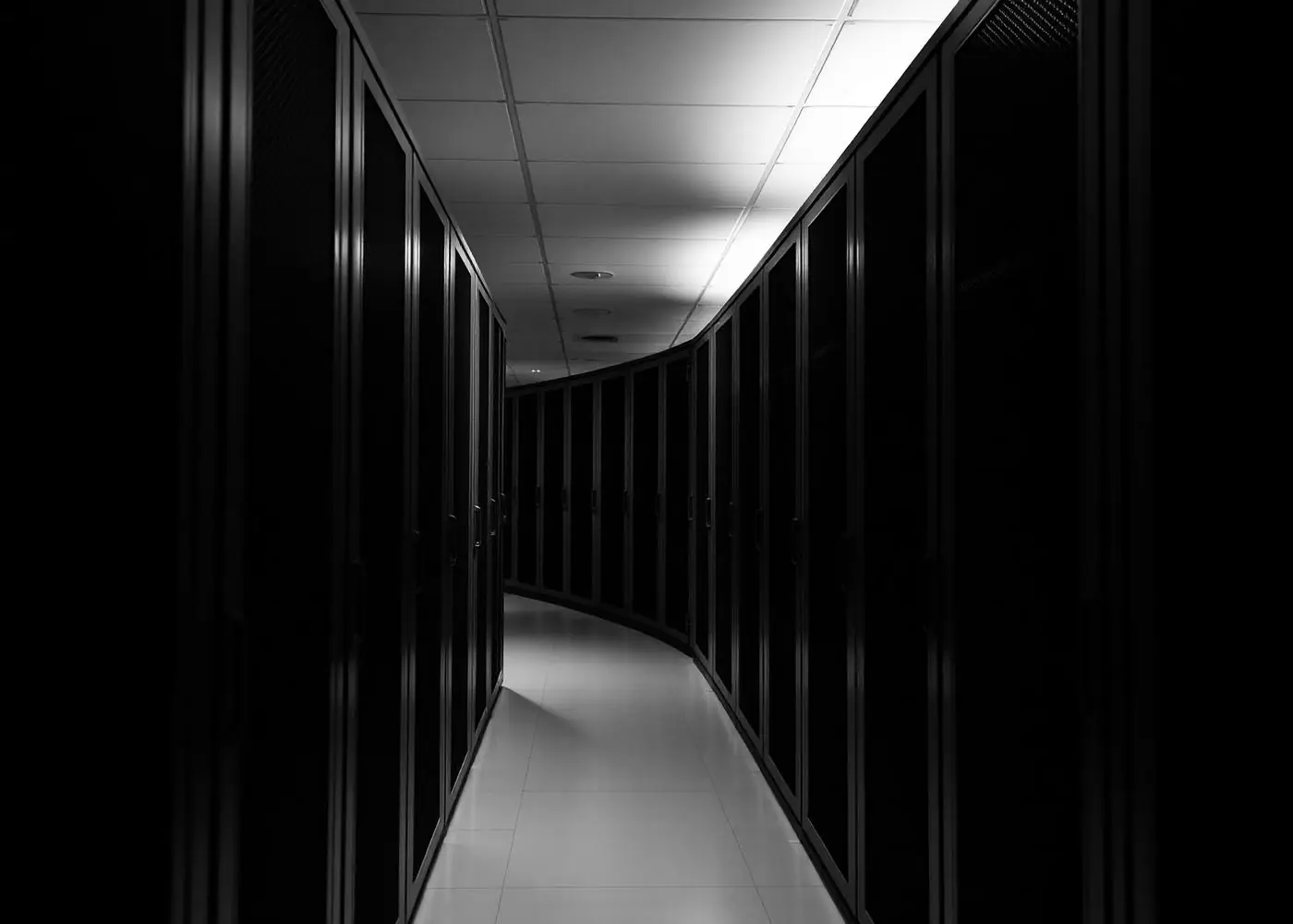 Server room corridor lit by overhead light
